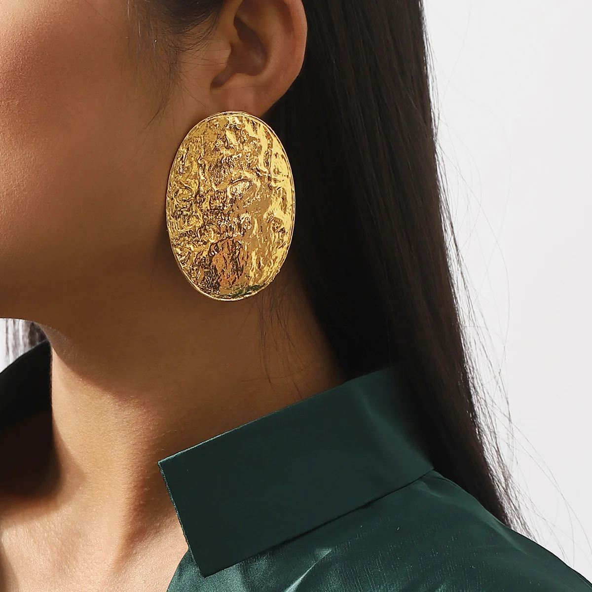 Minimalist style exaggerated alloy oval earrings with textured concave convex geometric metallic feel, fashionable earrings