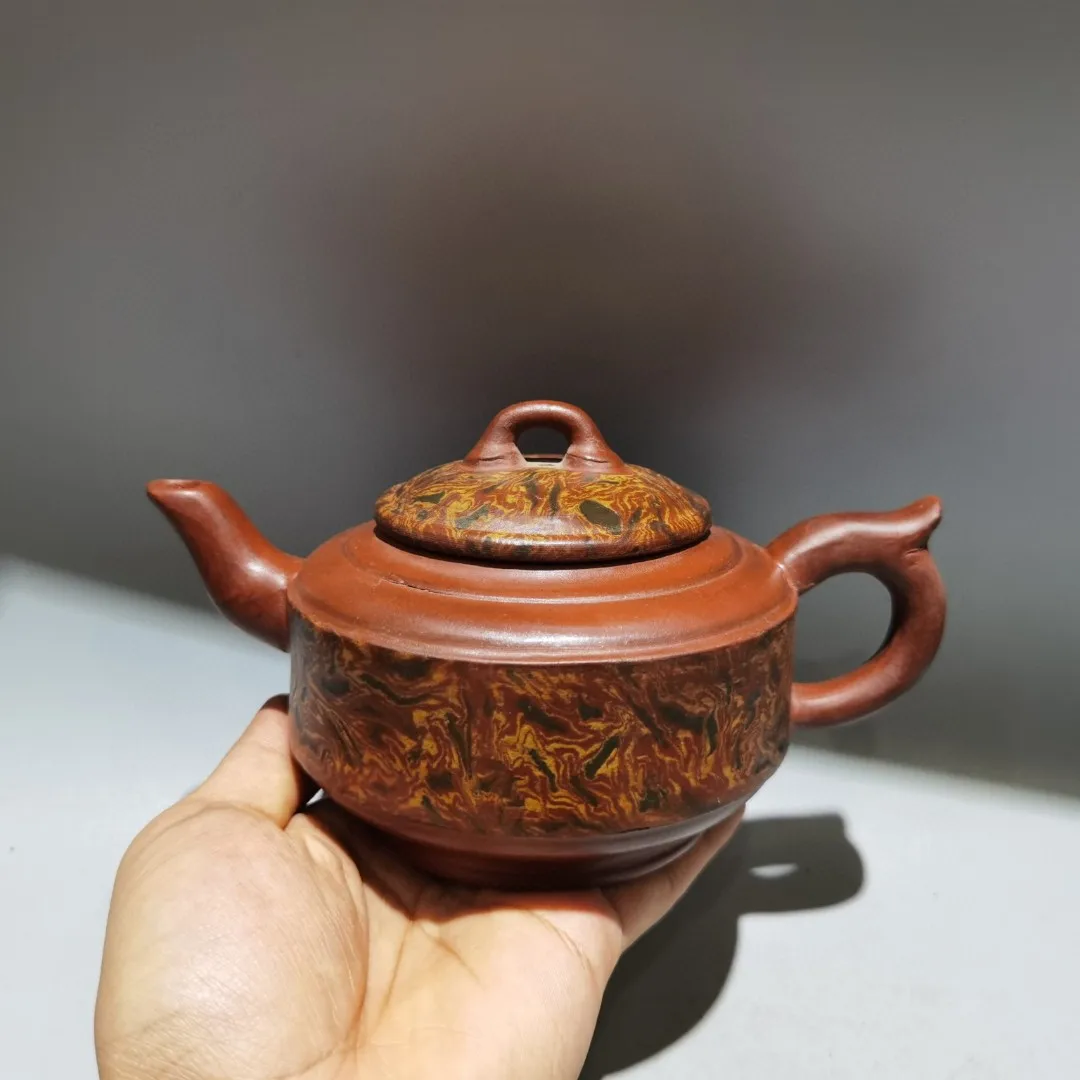 The Purple Clay Teapot is Finely Crafted and Has a Beautiful Appearance Making it a Home Craft Worth Decorating and Collecting