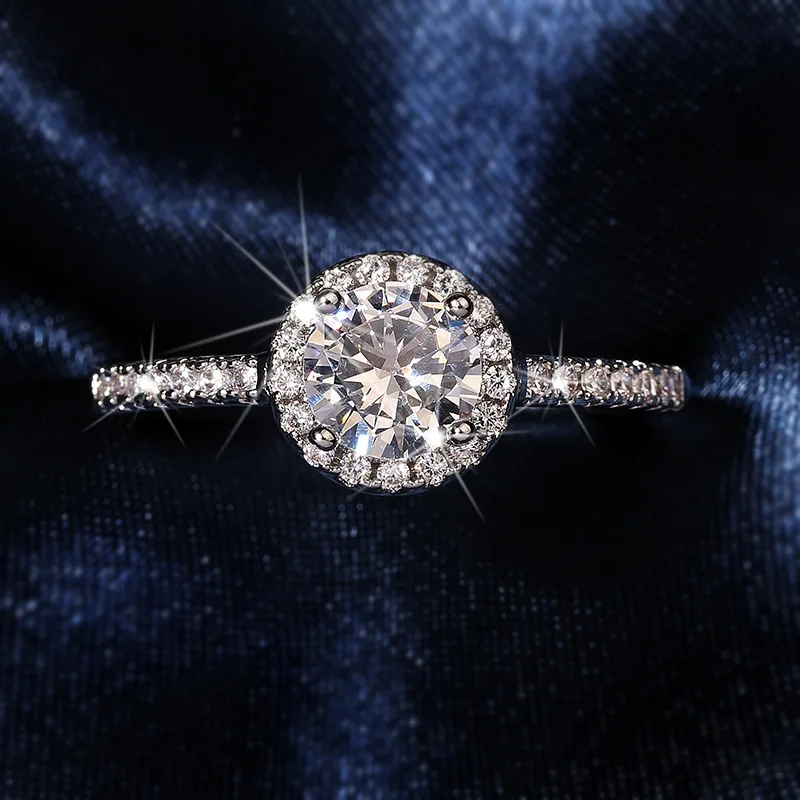 Elegant geometric brass ring with electroplated white steel finish featuring alloy-set colorless synthetic zirconia stones desig