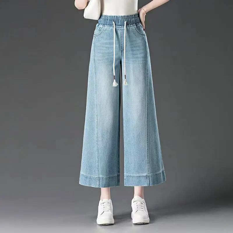 Spodnie damskie z wysokim stanem, szerokie nogawki, długość 7/8, elastyczna gumka w pasie, nowość na lato 2025, luźne, duże rozmiary, elastyczne jeansy.