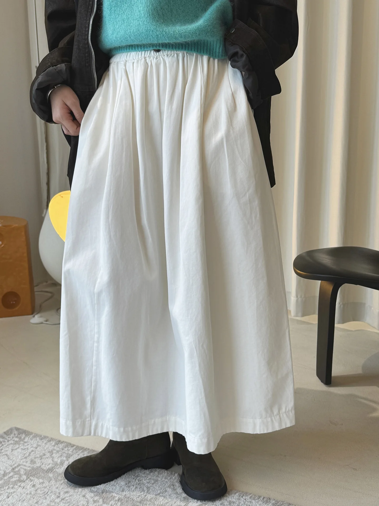 أوائل الربيع بسيطة عالية الخصر زر مرونة نصف تنورة فضفاضة التخسيس تنورة طويلة عادية للنساء