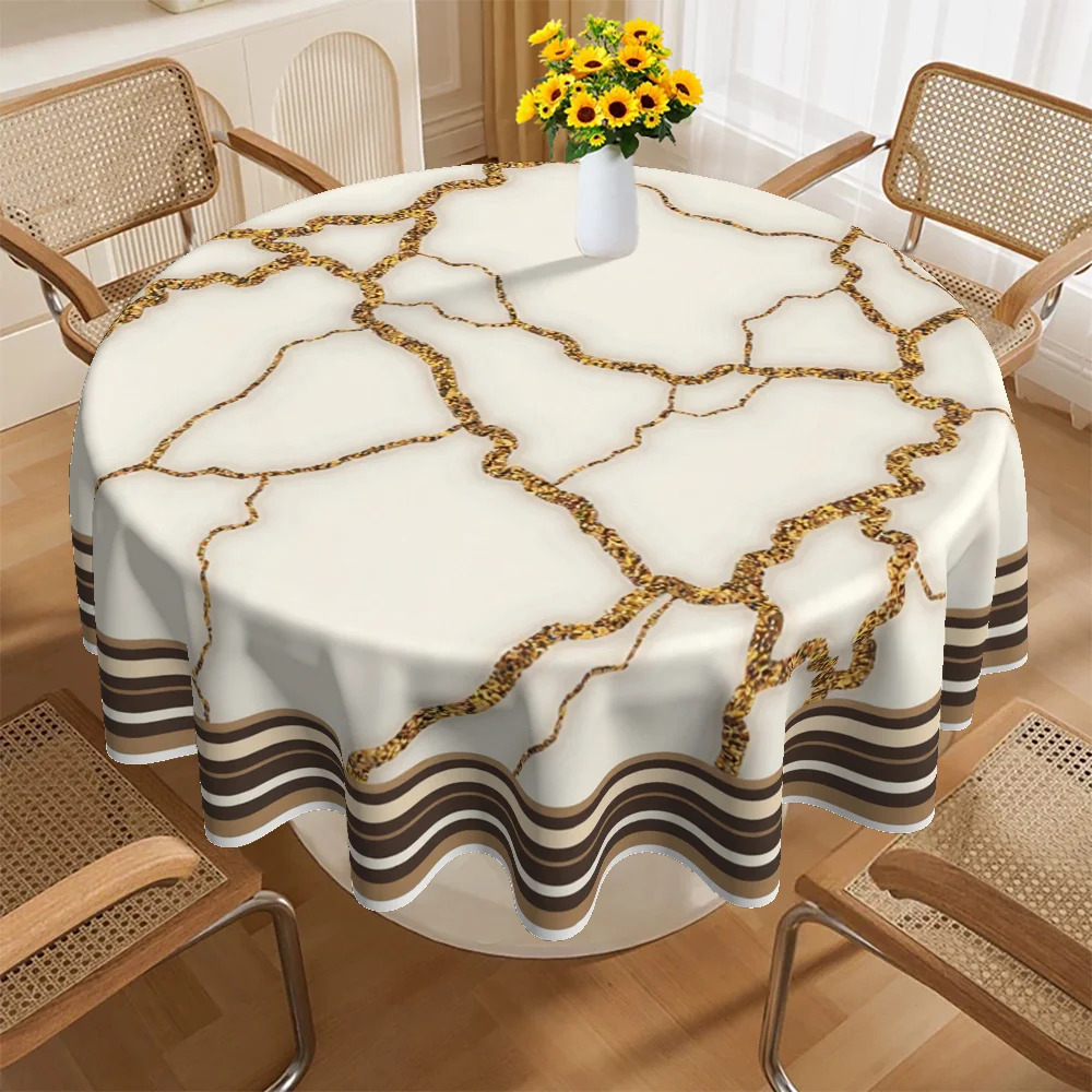 A round tablecloth, featuring a modern marble design in gold and white, is perfect for various occasions.zyc
