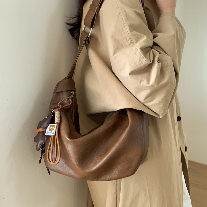 

Шикарная минималистичная женская сумка через плечо 2025, модный слинг с верхней ручкой и мягкой кожей для ежедневного использования и поездок на работу ​