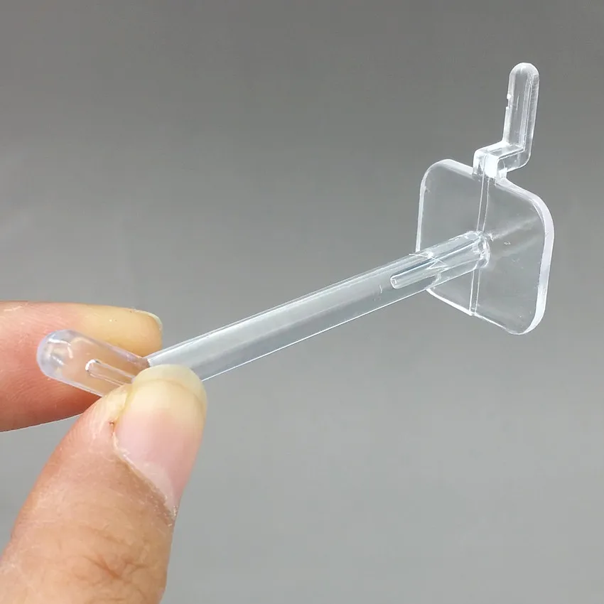 100 unidades de ganchos colgantes de plástico transparente para exhibición en estanterías, de un solo pie, para tablero de ranuras de supermercado y tablero de malla de almacenamiento