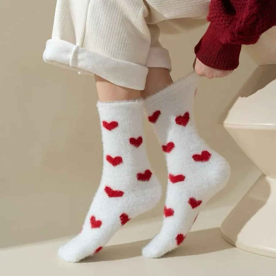 3 pairs of randomly colored women’s winter/fall heart-themed plush socks.