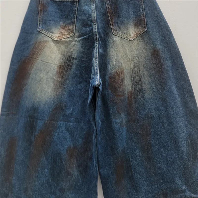 Spodnie damskie na jesień 2025, nowa moda, uniwersalne, wyszczuplające, luźne, z szerokimi nogawkami, jeansy w stylu vintage z efektem zniszczenia.