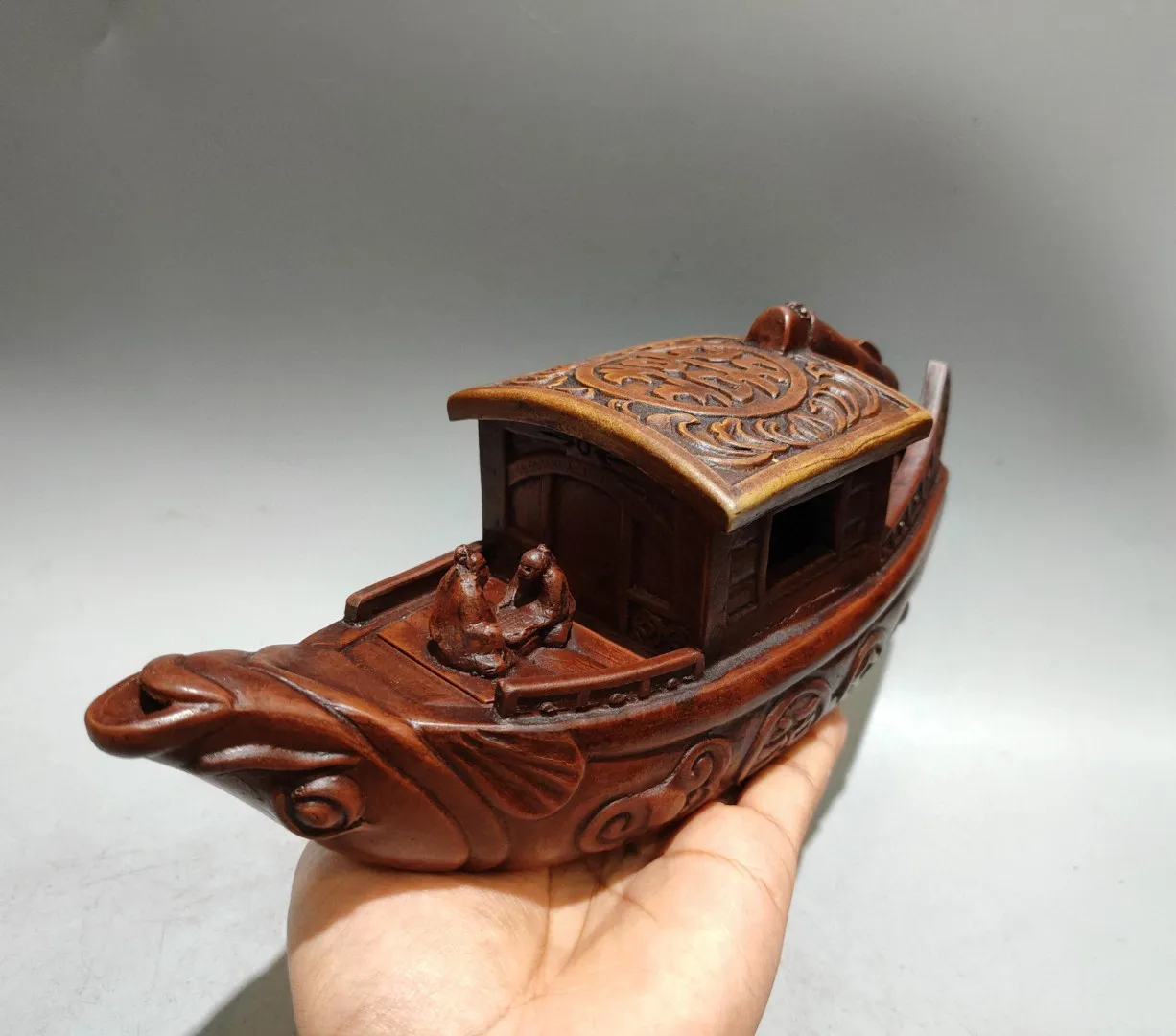 A traditional Chinese wedding boat-shaped teapot, with an inscription on the base reading 'Made during the Qianlo, Free shipping