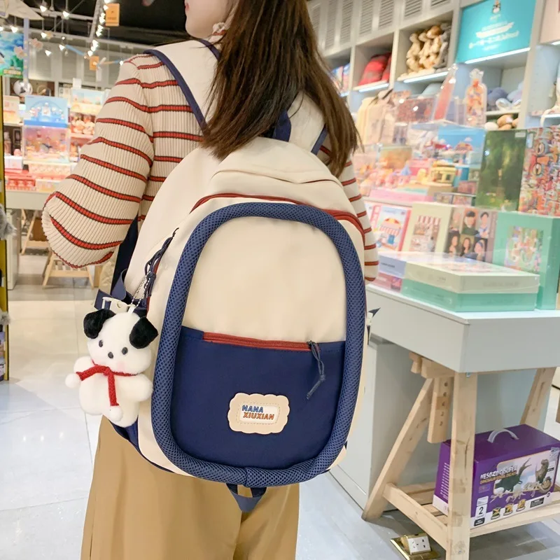 High appearance sweet and cute color blocked backpack fashionable and continuous circle middle and high school large capacity