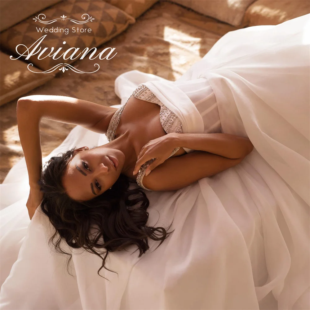 Aviana مخصص الحبيب الديكور إثارة ألف خط فستان الزفاف سويب تراين طول الأرض بلا أكمام الماس اللؤلؤ 2025
