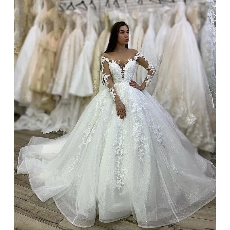 Elegant White Wedding Dresses Glitter Tulle Lace Appliques Long Sleeves Sheer Neck Floor Length A Line Bridal Gowns With Beads