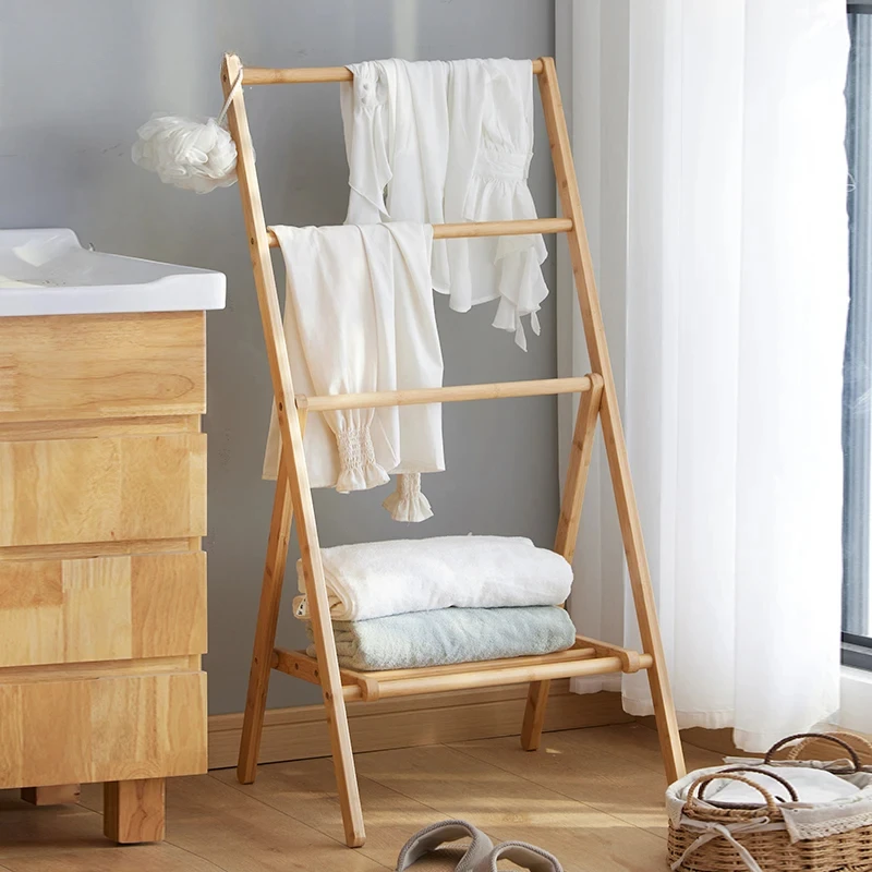 Put clothes artifacts at night by the bedside, bed and breakfast towel  temporary clothes rack by  of  bedroom, floor pants