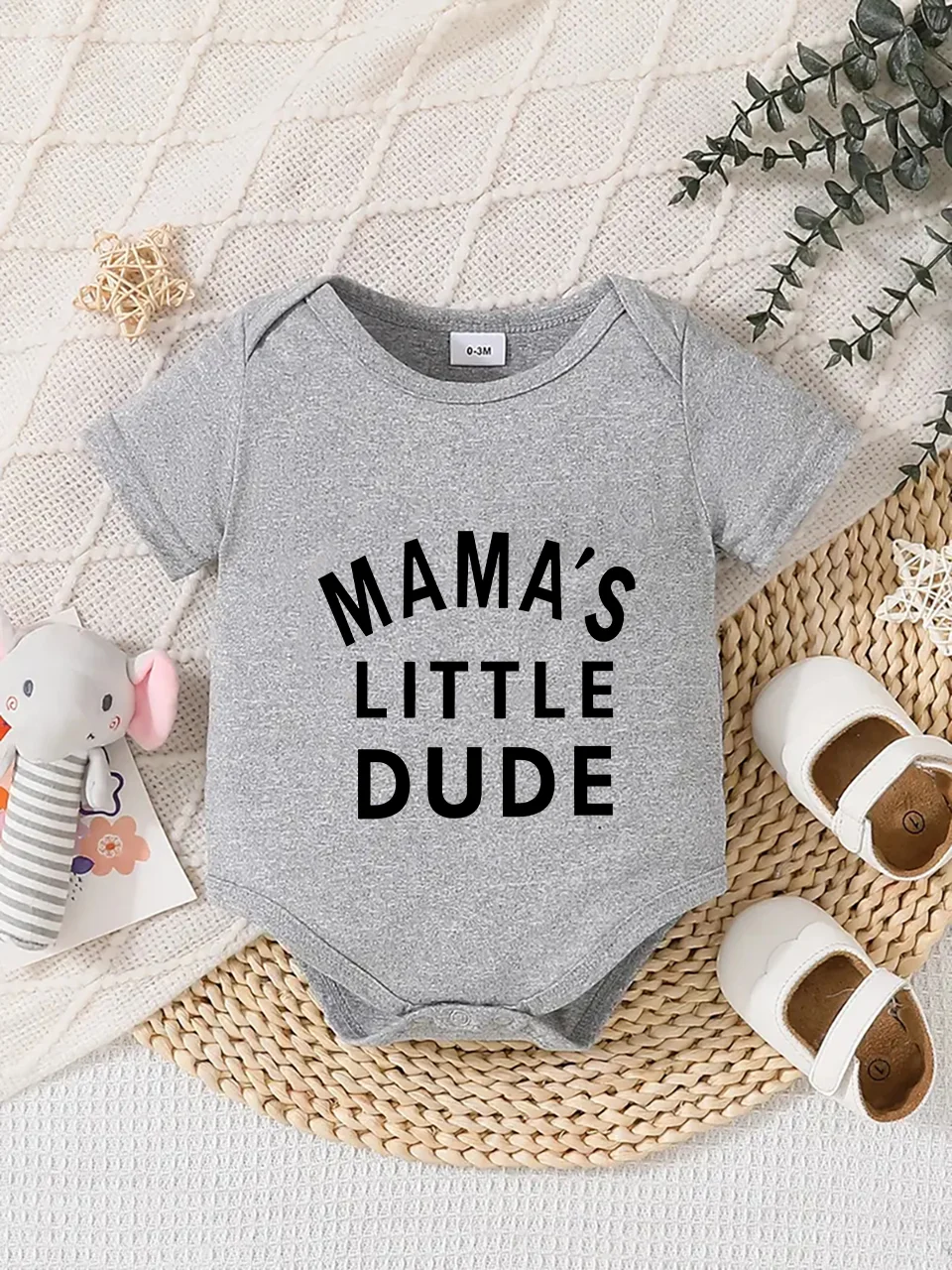 Playful letter-printed baby short-sleeve triangle bodysuit. Button closure for easy dressing, machine washable