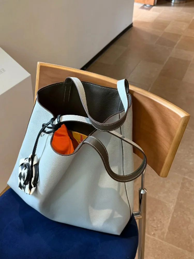 

Light Blue And Grey Spliced Tote Bag Women's 2026 New High-End Lightweight Luxury Commuter Single Shoulder Armpit Bag Summer
