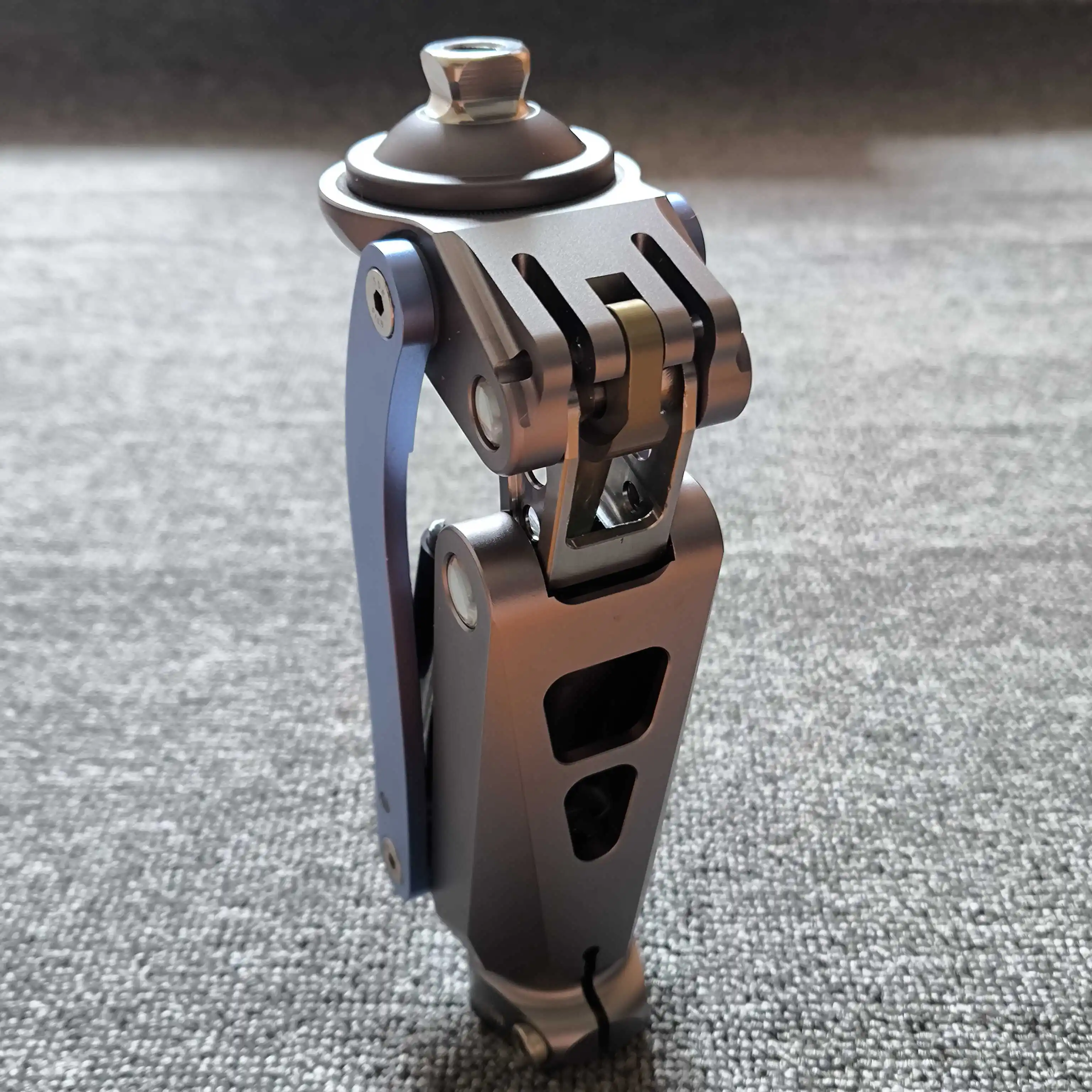 Pneumatic Knee Joint with Geometric Lock – Stance Phase Stability, Swing Phase Auto-Unlock for Above-Knee Amputees