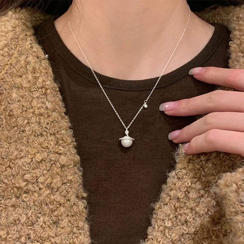 S925 فضة جميلة زحل قلادة المختنق قلادة بسيطة اللؤلؤ قلادة المرأة هدية الزفاف بوتيك غرامة مجوهرات