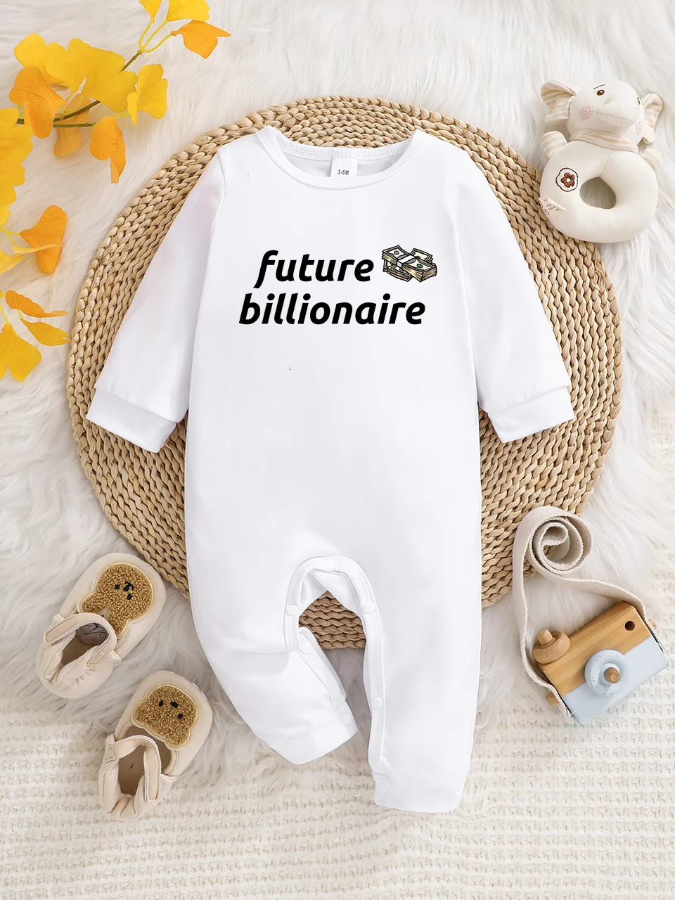 A baby long-sleeved onesie with interesting letter prints. It features a buttoned design for easy putting on and taking off