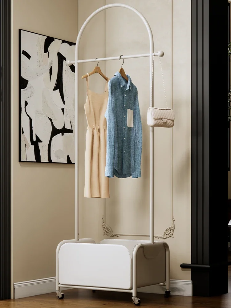 Clothes storage rack with basket, removable hanger in bedroom, coat rack in front of home living room