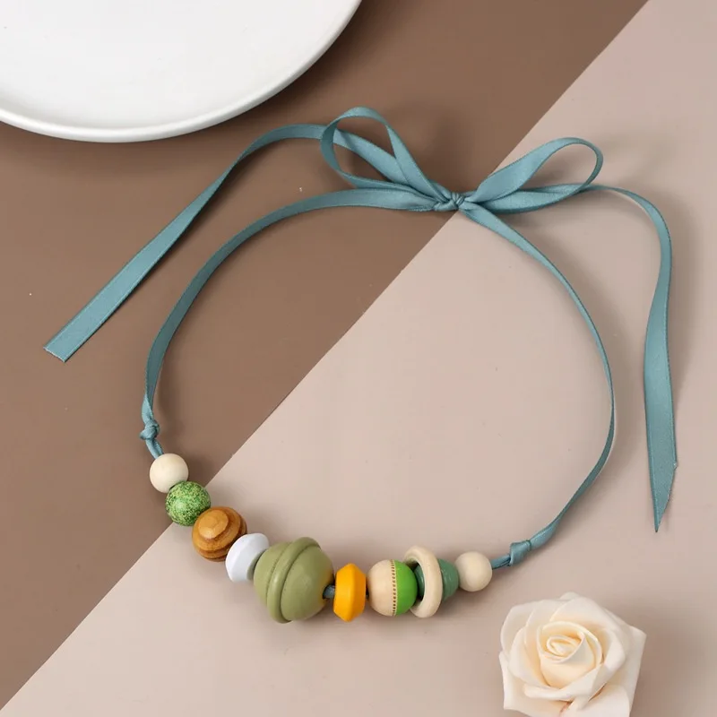 Retro color wood bead beaded bib necklace women's adjustable ribbon anti-allergic collarbone chain first-hand supply