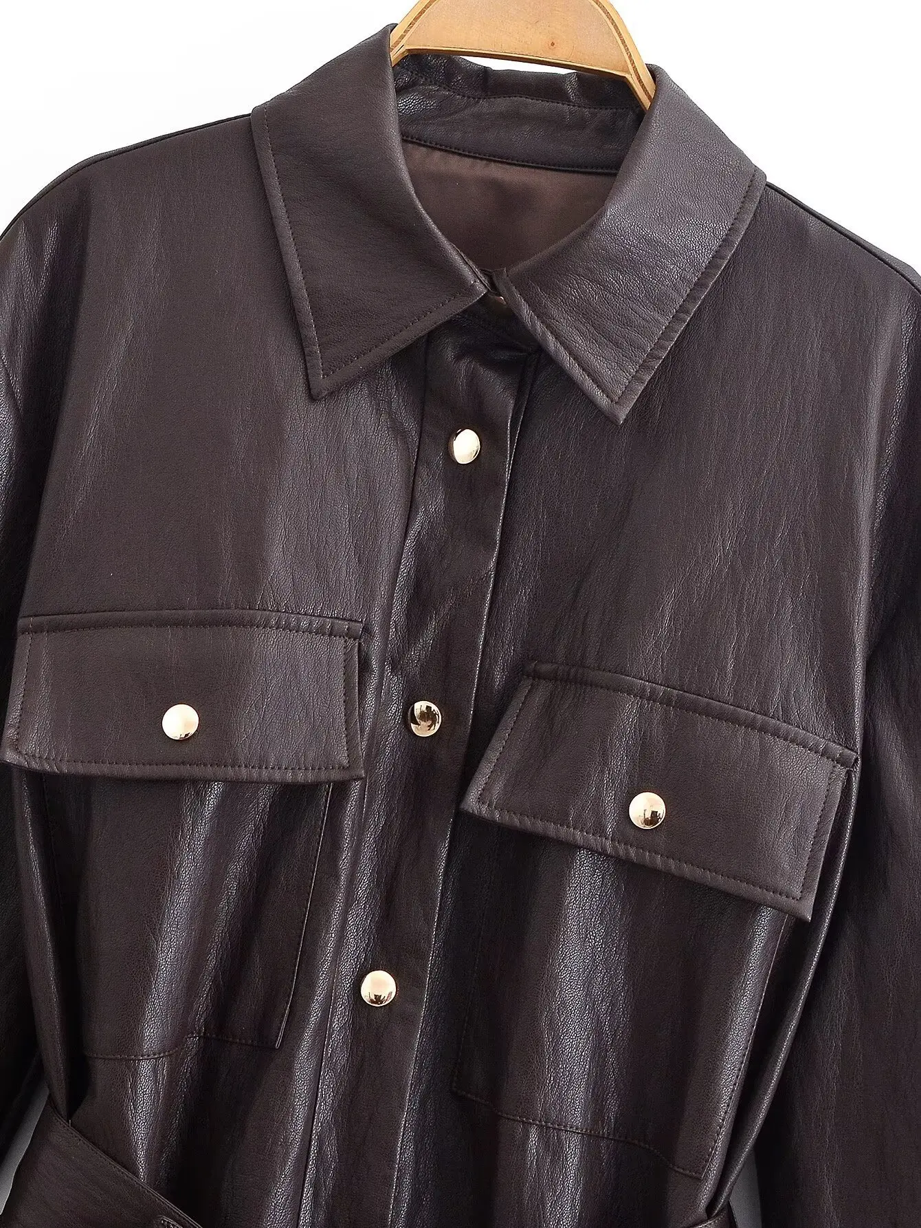 Damska odzież transgraniczna 2025 jesień i zima, styl europejski i amerykański, kurtka ze skóry PU z klapami i wiązaniem w talii.