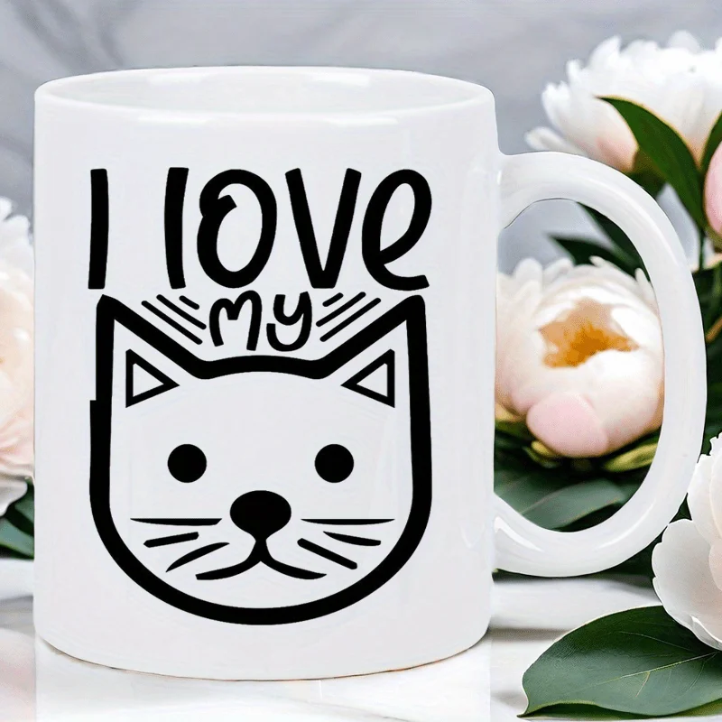This adorable cat-themed mug features the words 