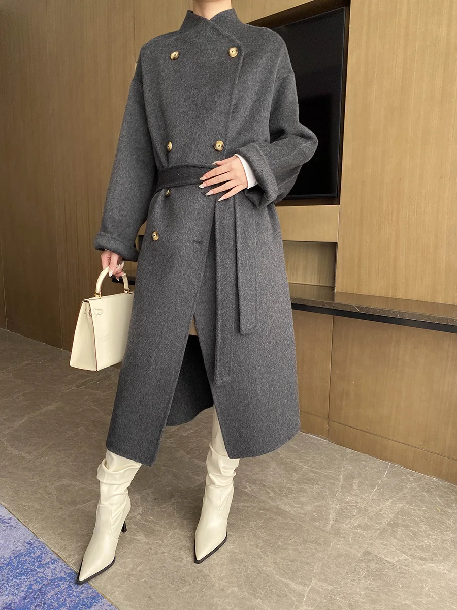 Autumn and winter women's casual solid color stand up collar long sleeved belt decoration loose long coat