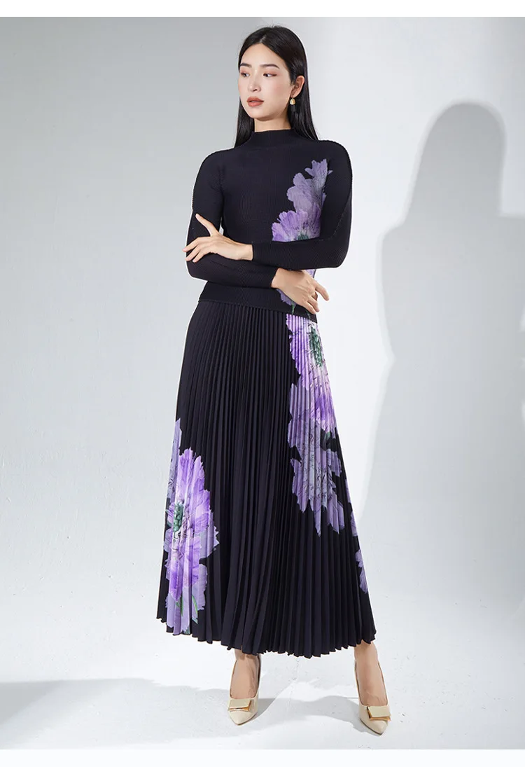A complete outfit for women, including a long-sleeved t-shirt and a printed pleated skirt – a two-piece set.