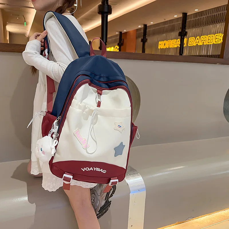 Picture 5: Waterproof nylon color-blocking student schoolbag, cute star-shaped large-capacity computer storage travel backpack