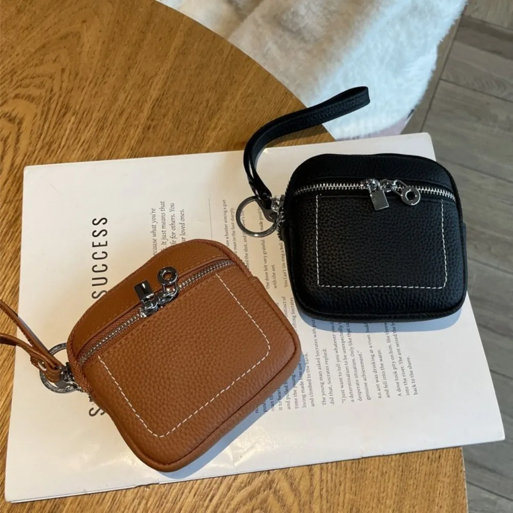 แฟชั่นซิปกระเป๋าใส่เหรียญหนัง PU พร้อมเชือกเส้นเล็กกระเป๋ารายการขนาดเล็กน้ําหนักเบาสีทึบลิปสติกหูฟังกระเป๋า