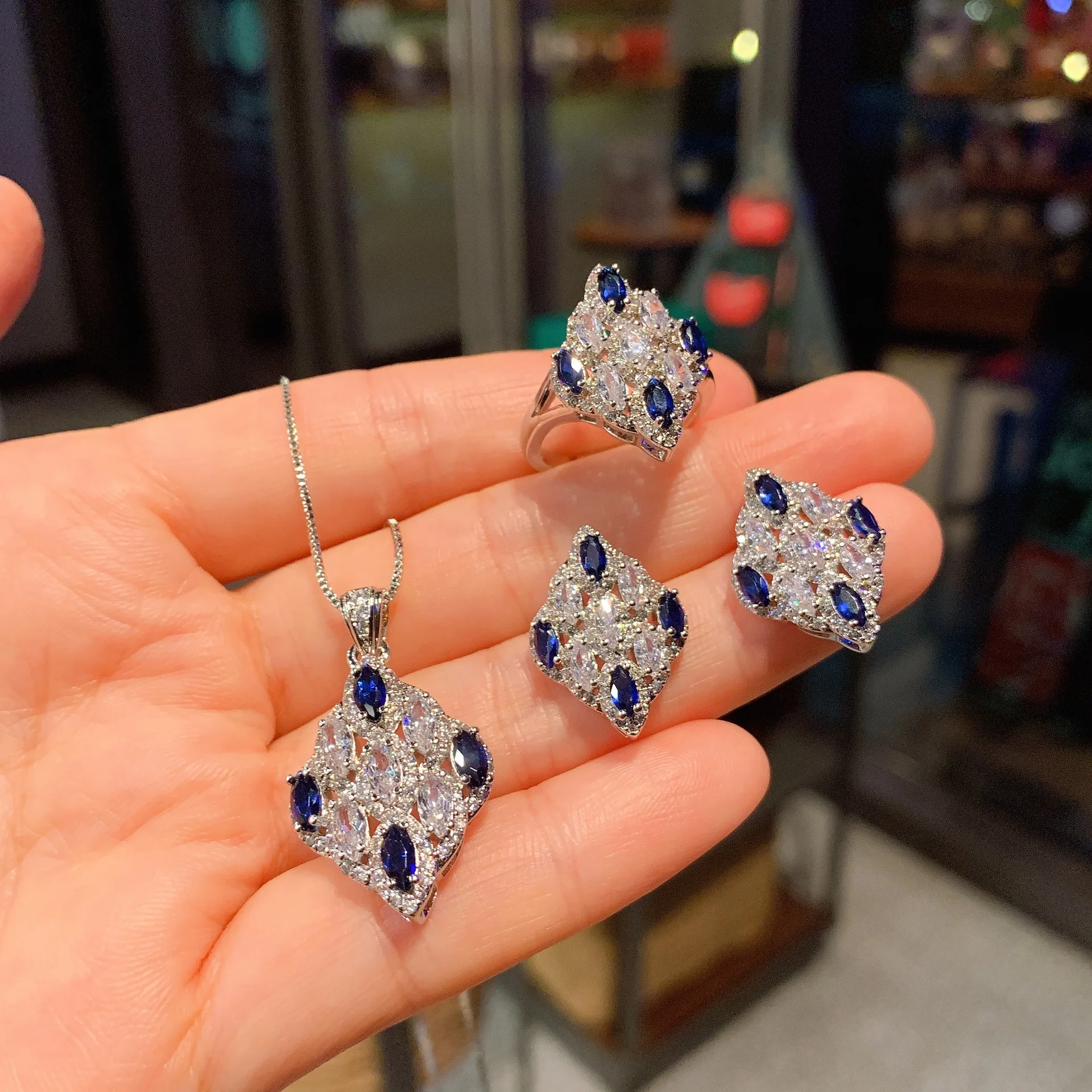 Luxury color sapphire sapphire ring earrings necklace jewelry three sets of European and American zircon pendant