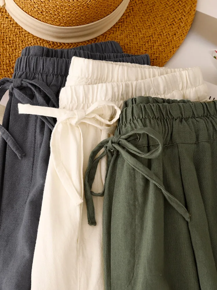 Artístico cor pura simples algodão linho perna larga ort calças femininas verão solto versátil casual algodão com punho calças de cinco quartos