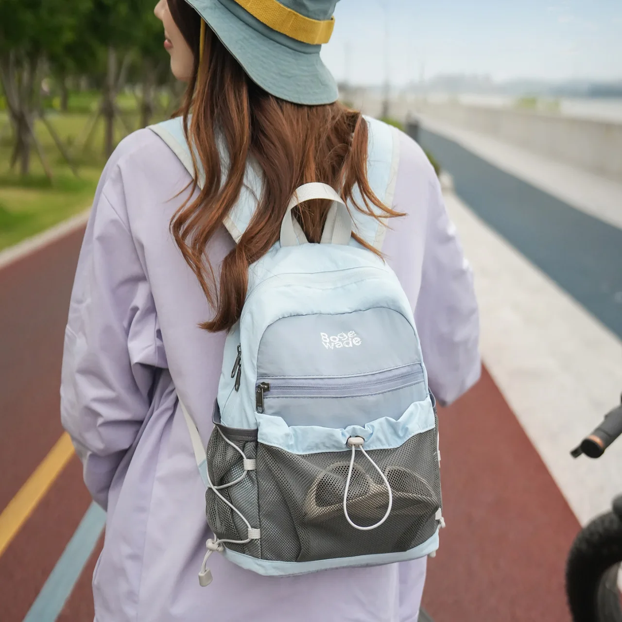 Women's Light Blue Nylon Backpack with Large Mesh Front Pocket and Adjustable Drawstring Casual Outdoor Sports Daypack