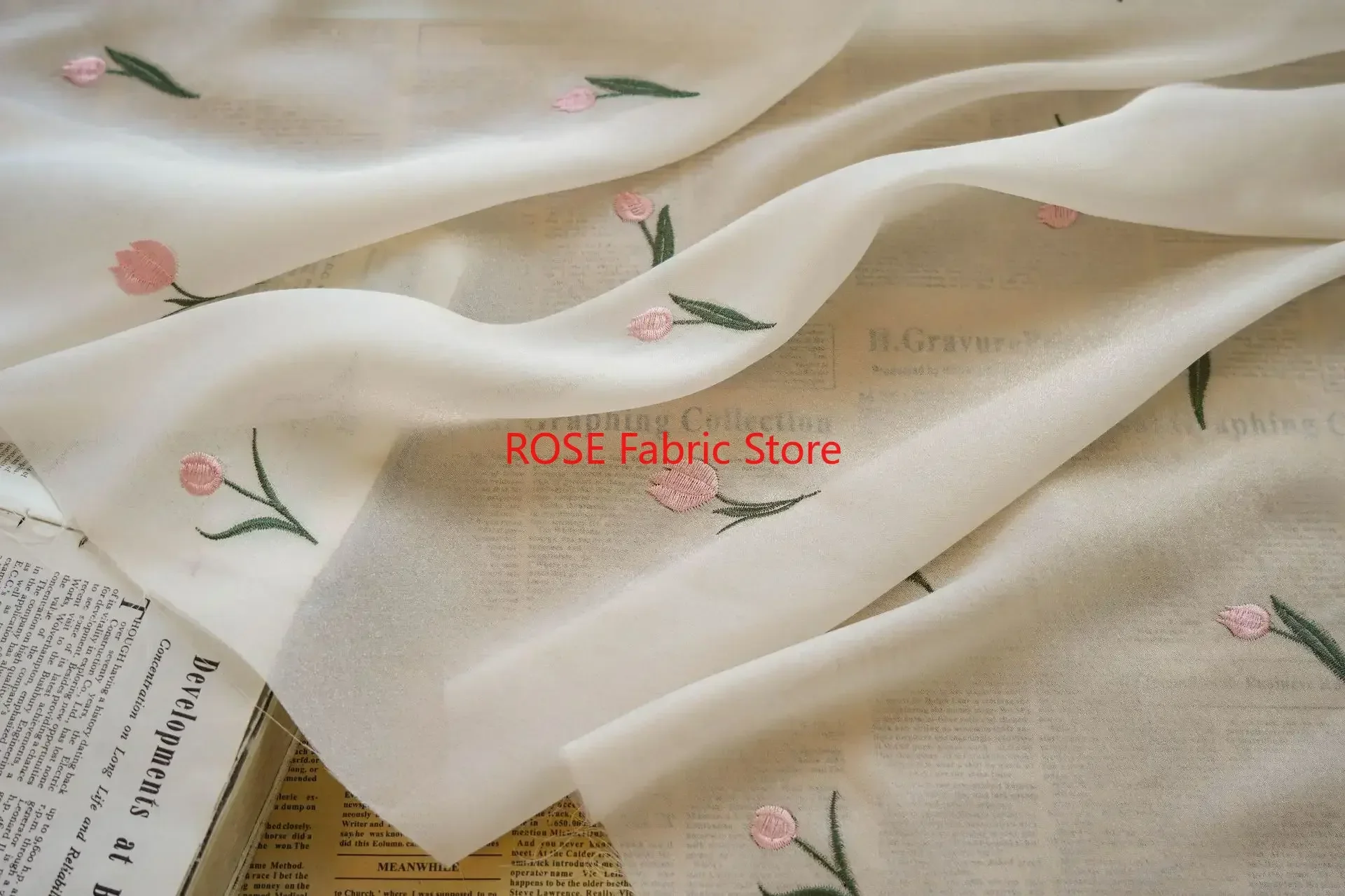 

Exquisite Light Apricot Tulip Embroidery Chiffon Fabric for Elegant Dress Designer Fabric
