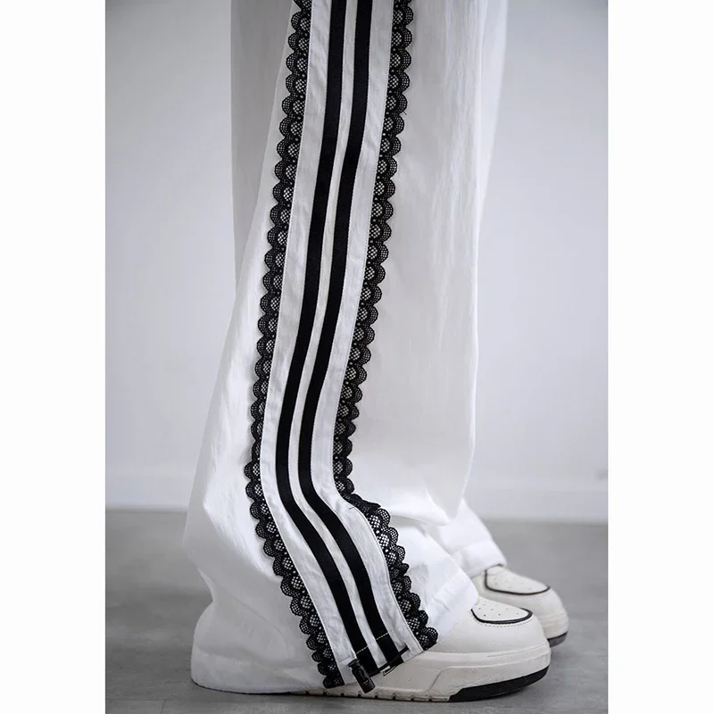 Eleganckie spodnie damskie z koronkowymi wstawkami, szybkoschnące, luźne, codzienne spodnie, modne spodnie w paski dla kobiet, cienkie spodnie od projektanta, kolekcja 2025.