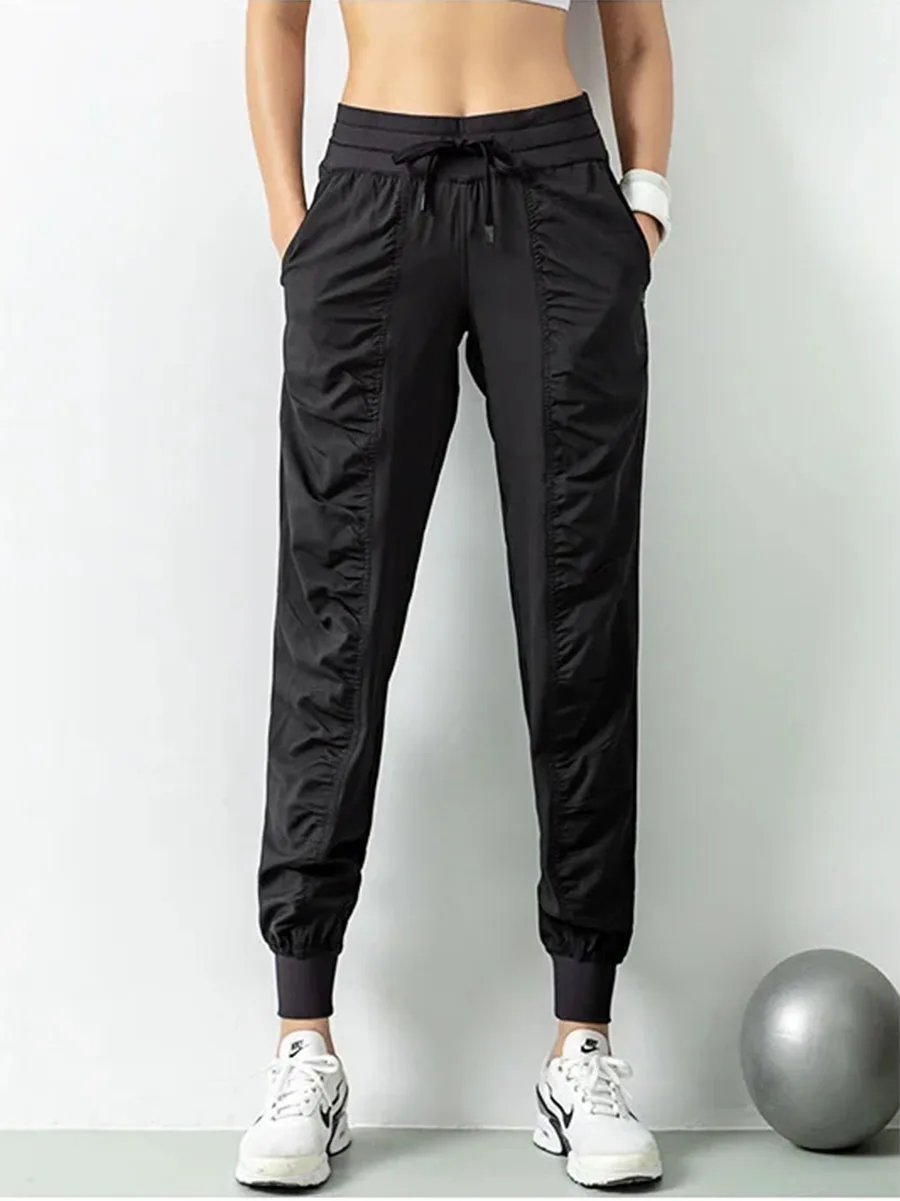 Calças esportivas femininas CZGUKE de cintura alta, com detalhes franzidos, design com bolso, respiráveis, leves, para treino e uso casual.
