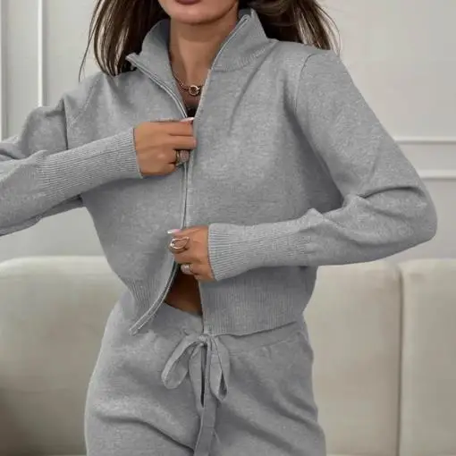 Tweedelige set damesoutfit 2025 herfst winter nieuwe commuter dubbele rits lange mouw gebreide top en hoge taille casual broek set