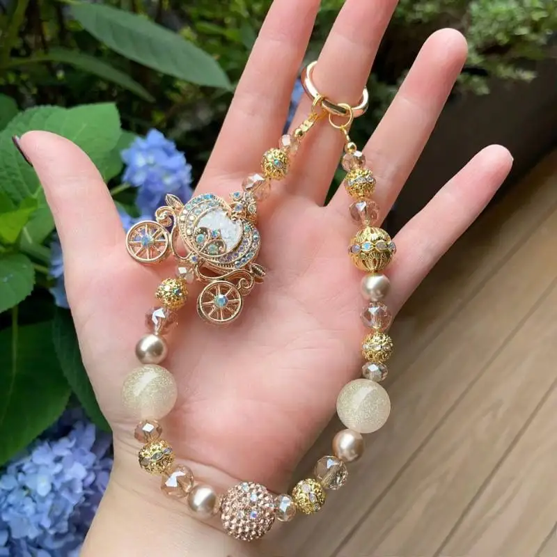 Premium Sense Dream Champagne Pumpkin Car Beaded Mobile Phone Bag Chain Heavy Industry Diamond Inlaid Gentle Niche Bag Hanging