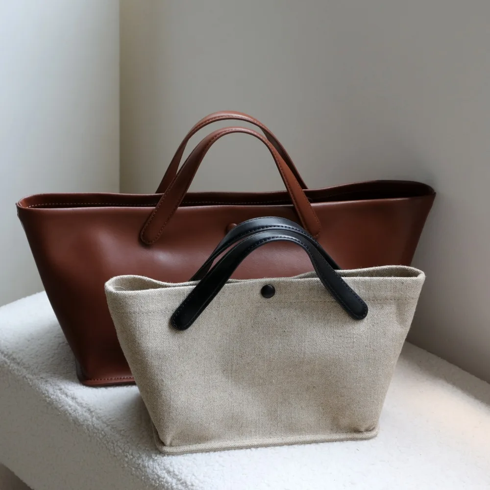

Niche design bags, fashionable commuter tote bags, retro high-end leather women's portable messenger bags, large capacity