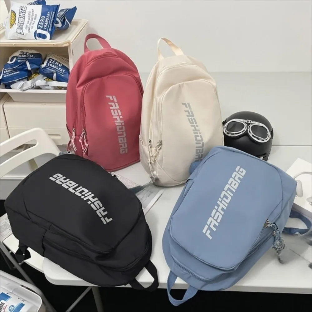 Nueva mochila escolar de gran capacidad, bolsa universitaria ligera con letras, bolsa de libros impermeable