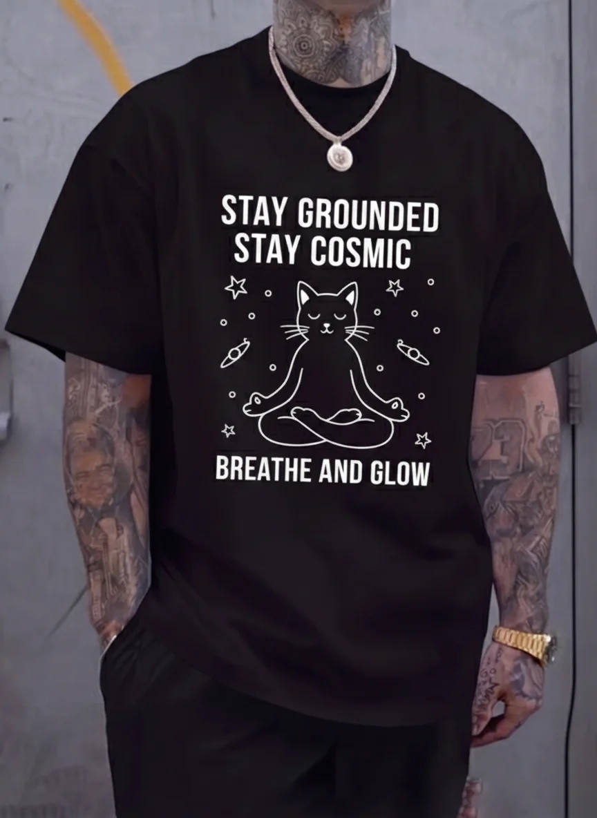 

Stay Grounded Stay Cosmic Meditating Cat Graphic Tee Printed Tee Black Line Art Cat with Stars and Planets Zen Yoga Cat t Shirt