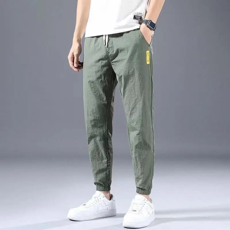 Summer New 2024 Ice Shreds Bound Feet Men Solid Color Pants Loose Casual Comfortable Elastic Waist All-match Nine Point Pants