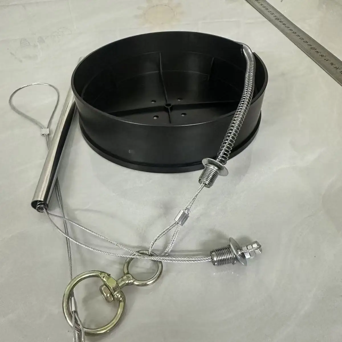 

Replacement of stronger spring with nut-type wire rope