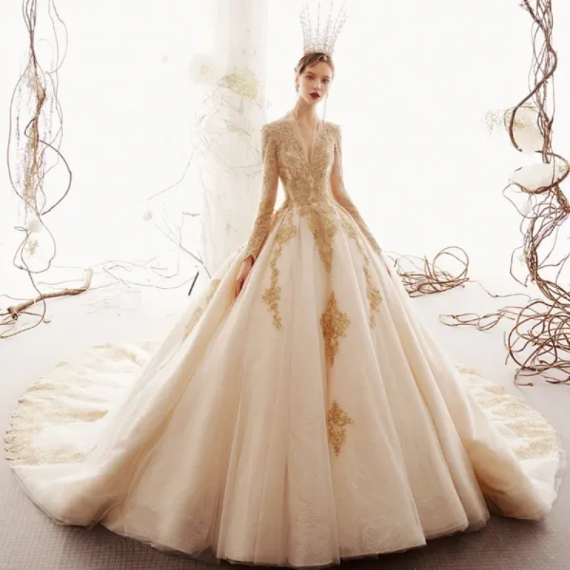 Customized Wedding Dress For 2025 Deep V-Neck Long Sleeves Beige Color Gold Lace Decal Large Skirt Backless Gorgeous Retro Style