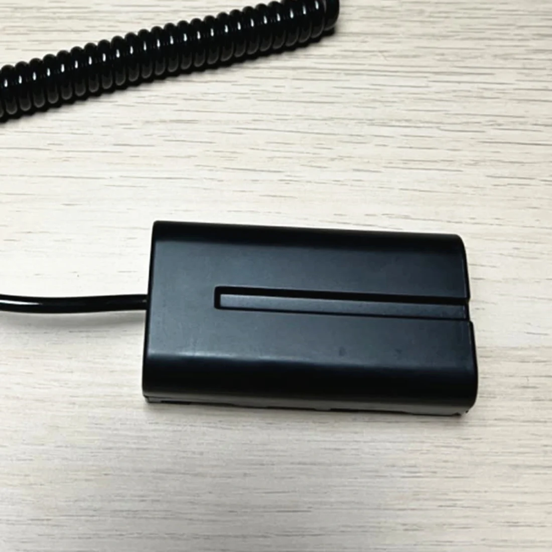 

X46A_Coiled D-Tap to L-Series F550 Battery Dummy Cable for Sony