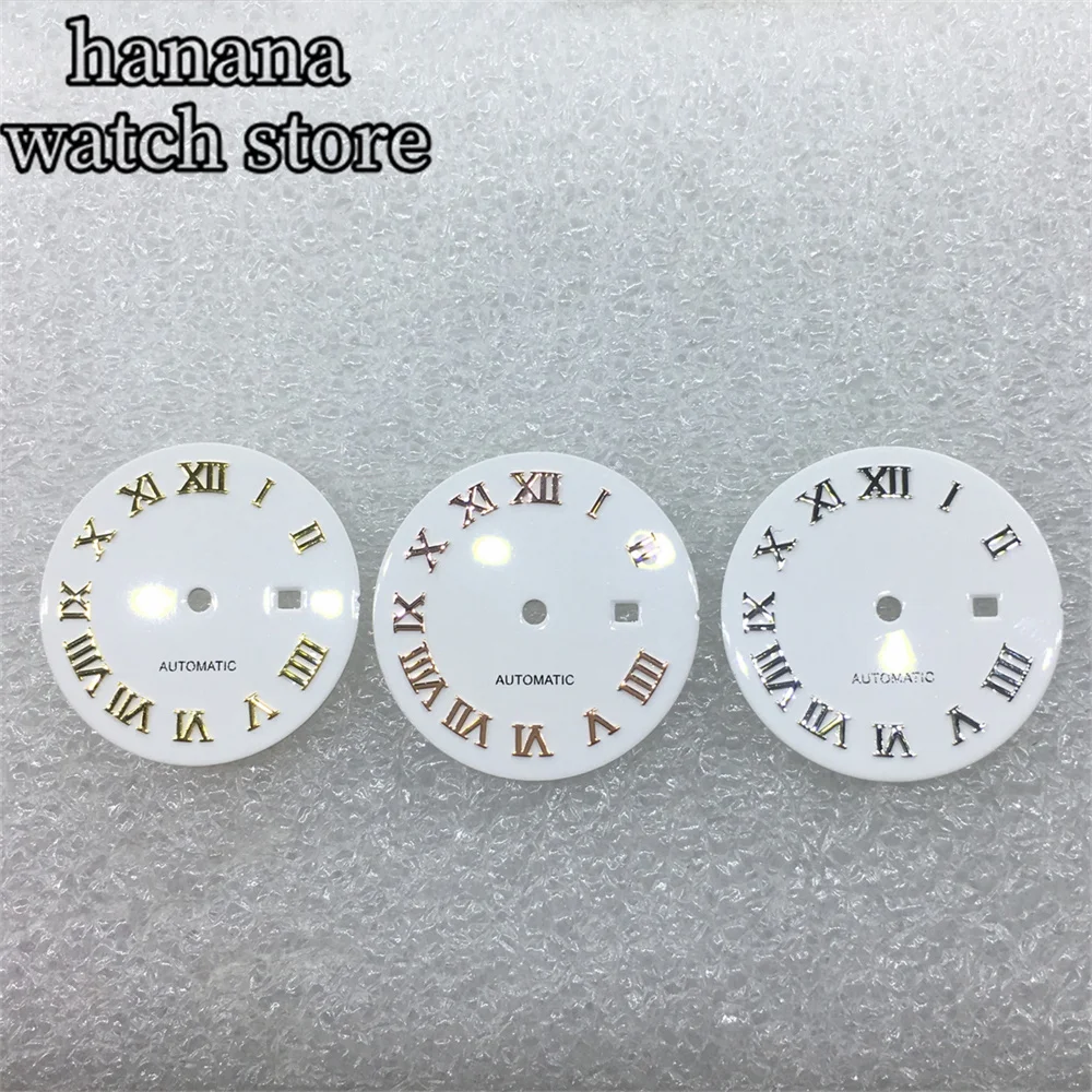 قرص NH05 للسيدات مقاس 24.5 ملم باللون الأسود والذهبي والوردي ومينا للتعرض اليومي باللون الأبيض اللامع مع مؤشر روماني يدوي مناسب لحركة NH05