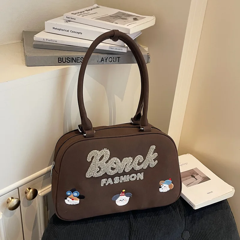 Hot-selling Korean version of cartoon cute embroidered handbag fashionable texture large capacity portable going out women's bag