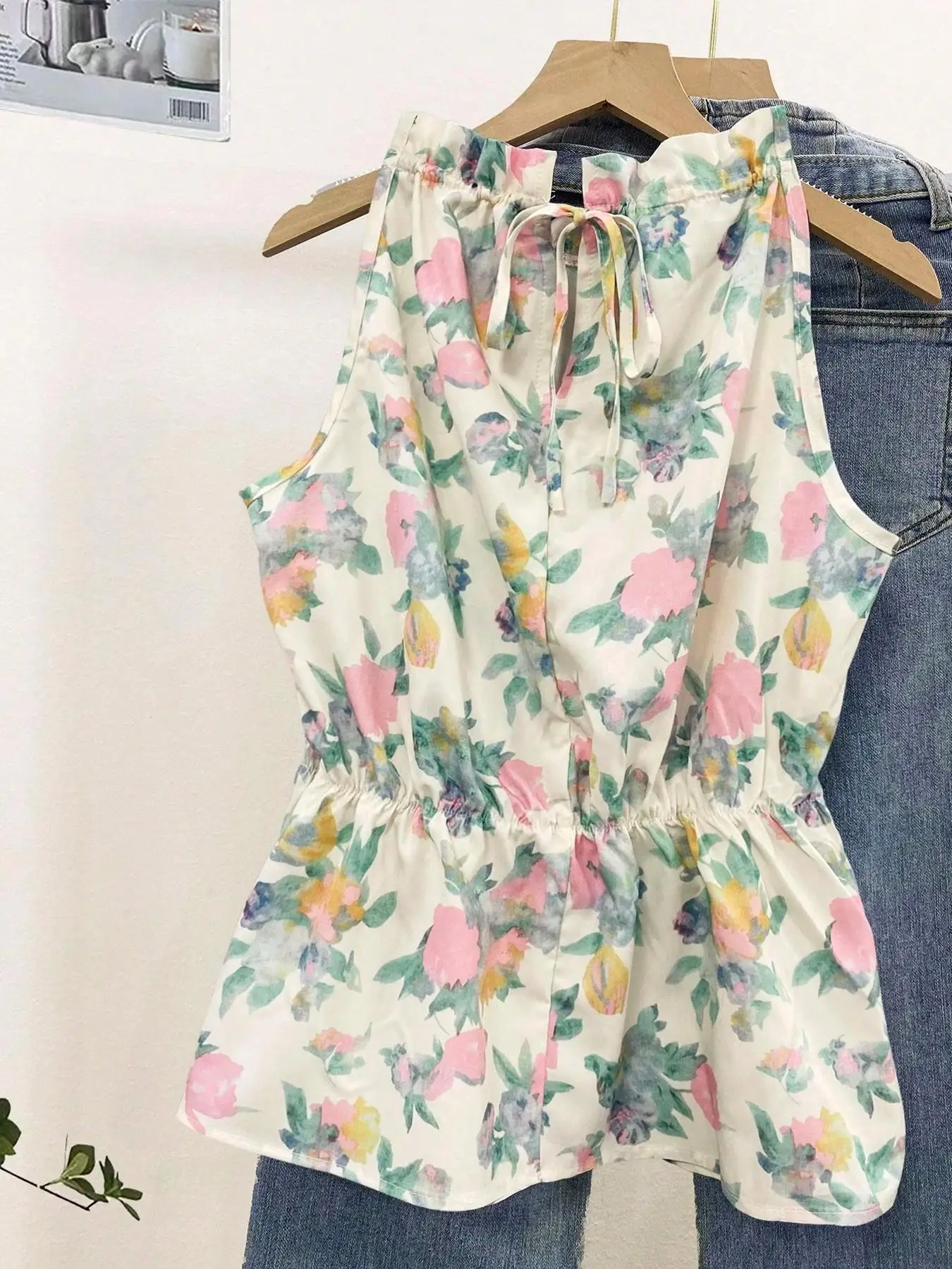 Ladies Woven Floral Print Sleeveless Top with Ruffle Collar Back Tie Waist And Flared Hemline Single Piece