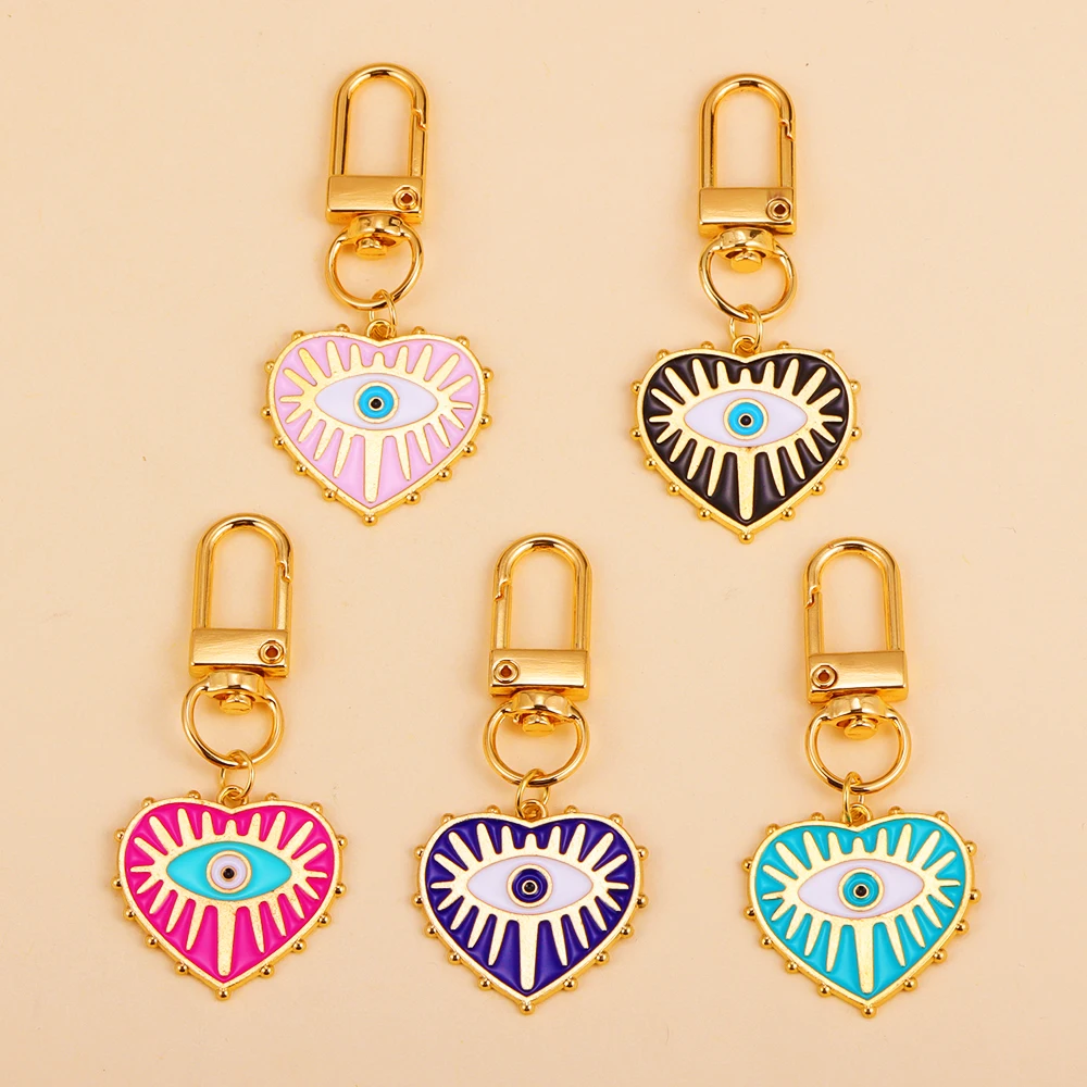 Llaveros de aleación con cierre giratorio para mujer, llavero con colgante de corazón de amor, ojo azul malvado, accesorio de decoración para bolso
