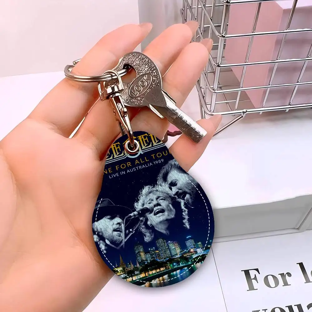 Bee Gees Band الرجال والنساء العالمي مانع االصدأ المفاتيح بولي Leather الجلود حامل بطاقة الوصول قطرة مفتاح العلامة الدائري
