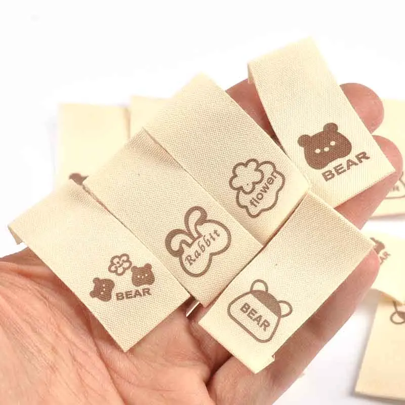 50pcs 20x40mm Mixed Begie Bear/Rabbit/Flower Cartoon Printed Label For Clothes Sewing Accessories DIY Tags Handmade Crafts C4146