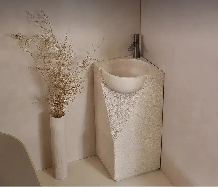 A Japanese cream style column basin floor-to-ceiling integrated art wash basin stone creative face table